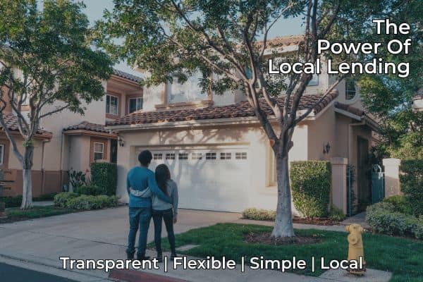 Raleigh couple standing in front of new home thanks to local lending